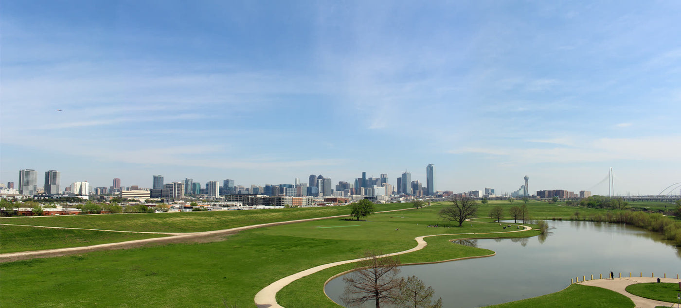 Downtown Dallas skyline from the Trinity River floodplain, the announced metro for MotionTech’s U.S. base — not a MotionTech facility