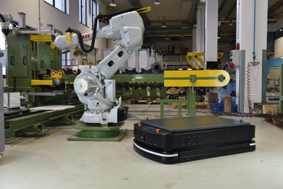 Stand-in warehouse automated guided vehicle carrying a load — illustrative only, not an ACTIVE Shuttle or NEURA product