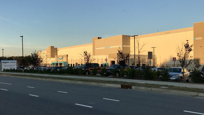 Amazon warehouse exterior in Garner, North Carolina — stand-in large warehouse, not Parts Town's Pendergrass, Georgia site