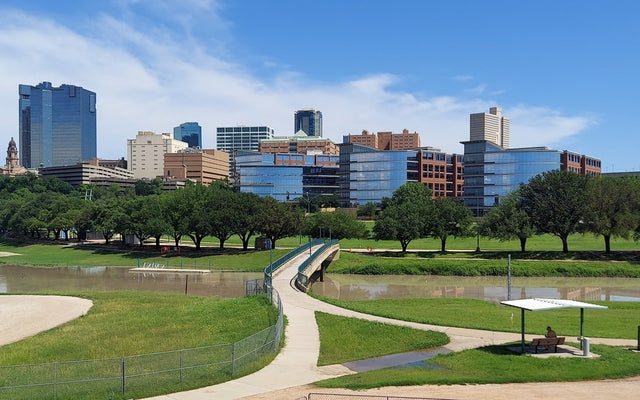 Downtown Fort Worth skyline across the Trinity River, illustrative of the competing city, not the Carter Crossing plant site