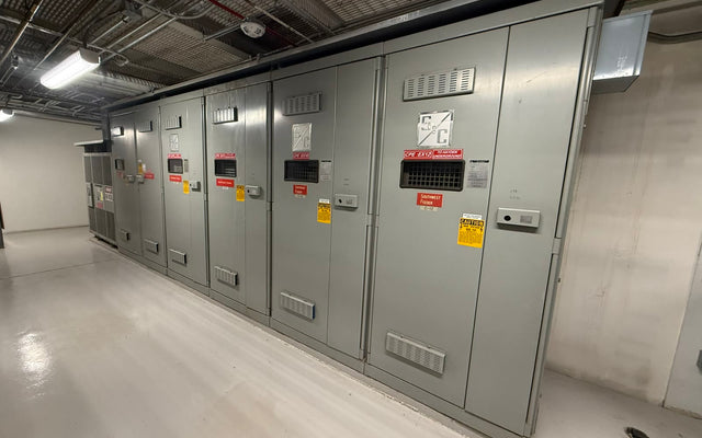 Indoor medium-voltage electrical switchgear cabinets — stand-in, not an IEM product and not the San Antonio plant